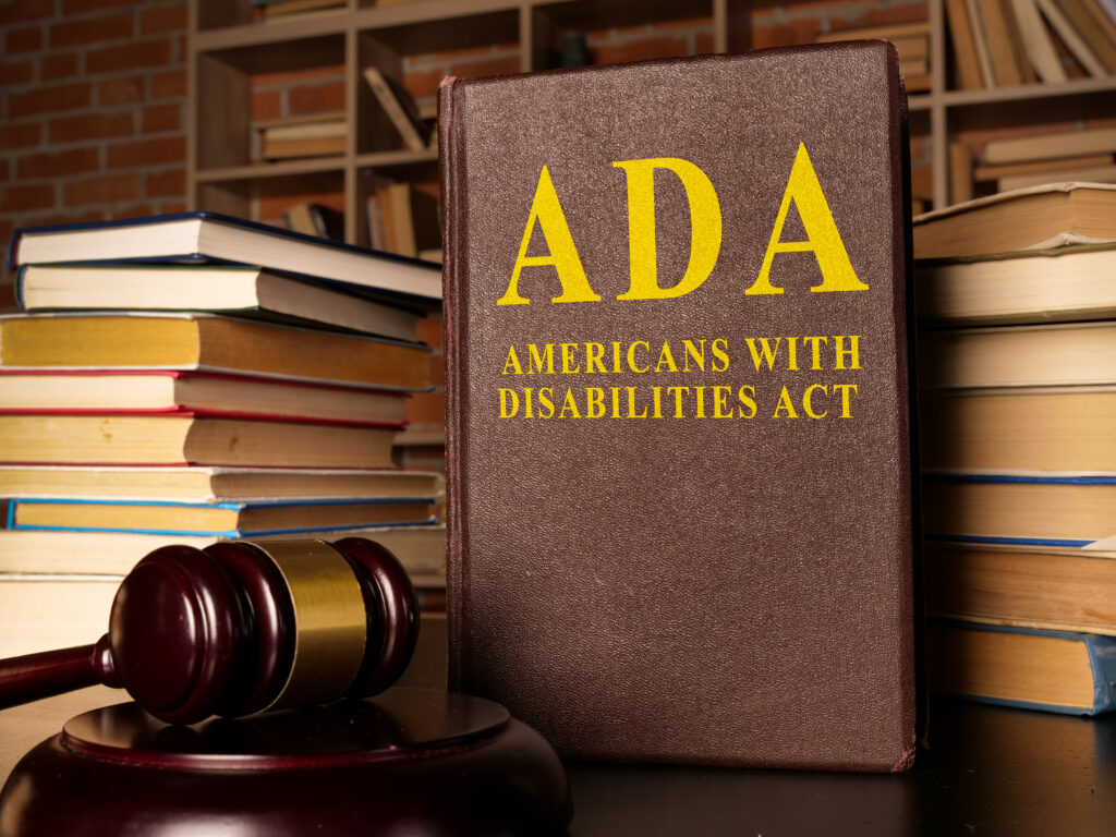 Law books and gavel with ADA on book
